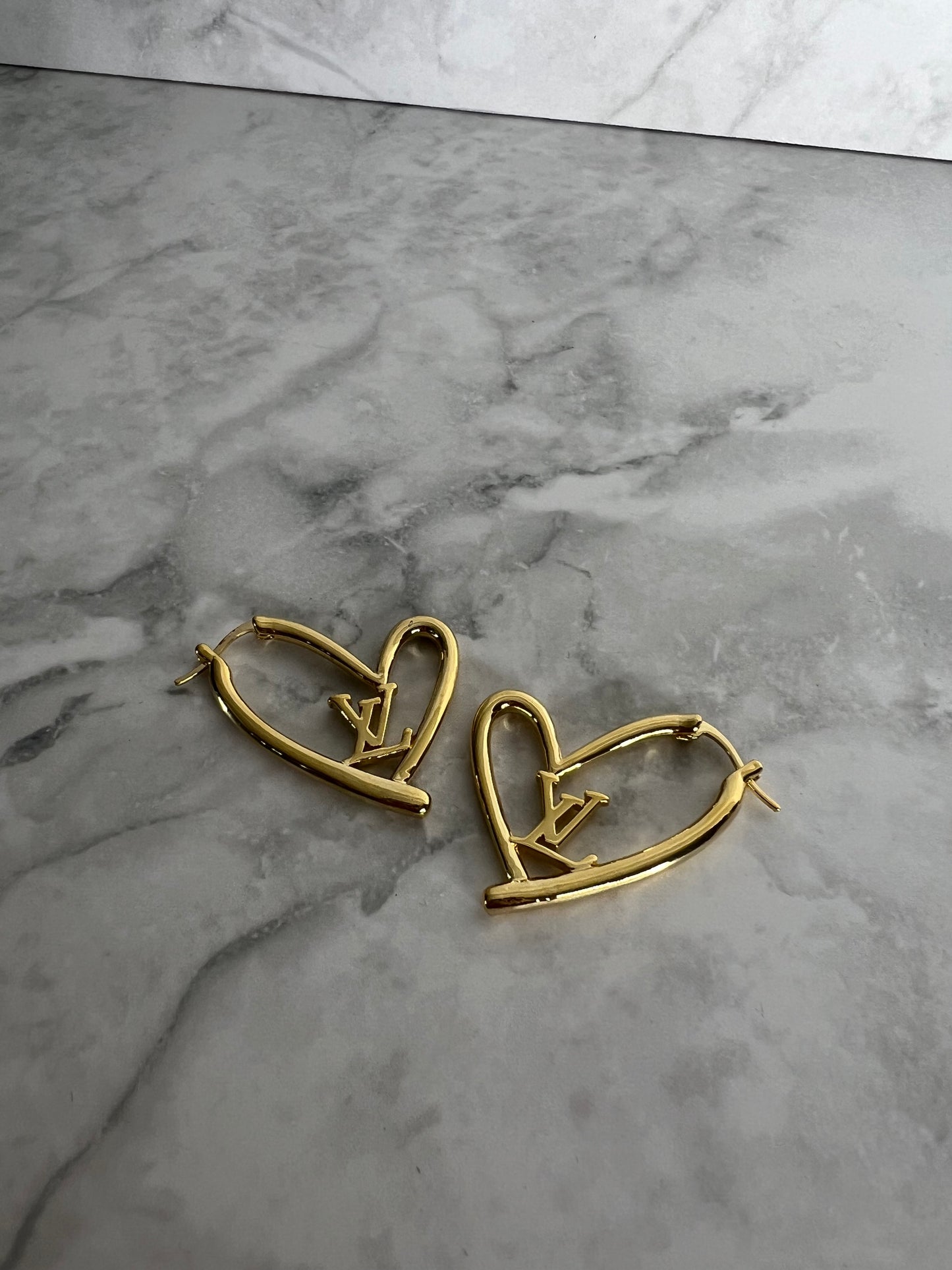 Heart shaped earrings lv