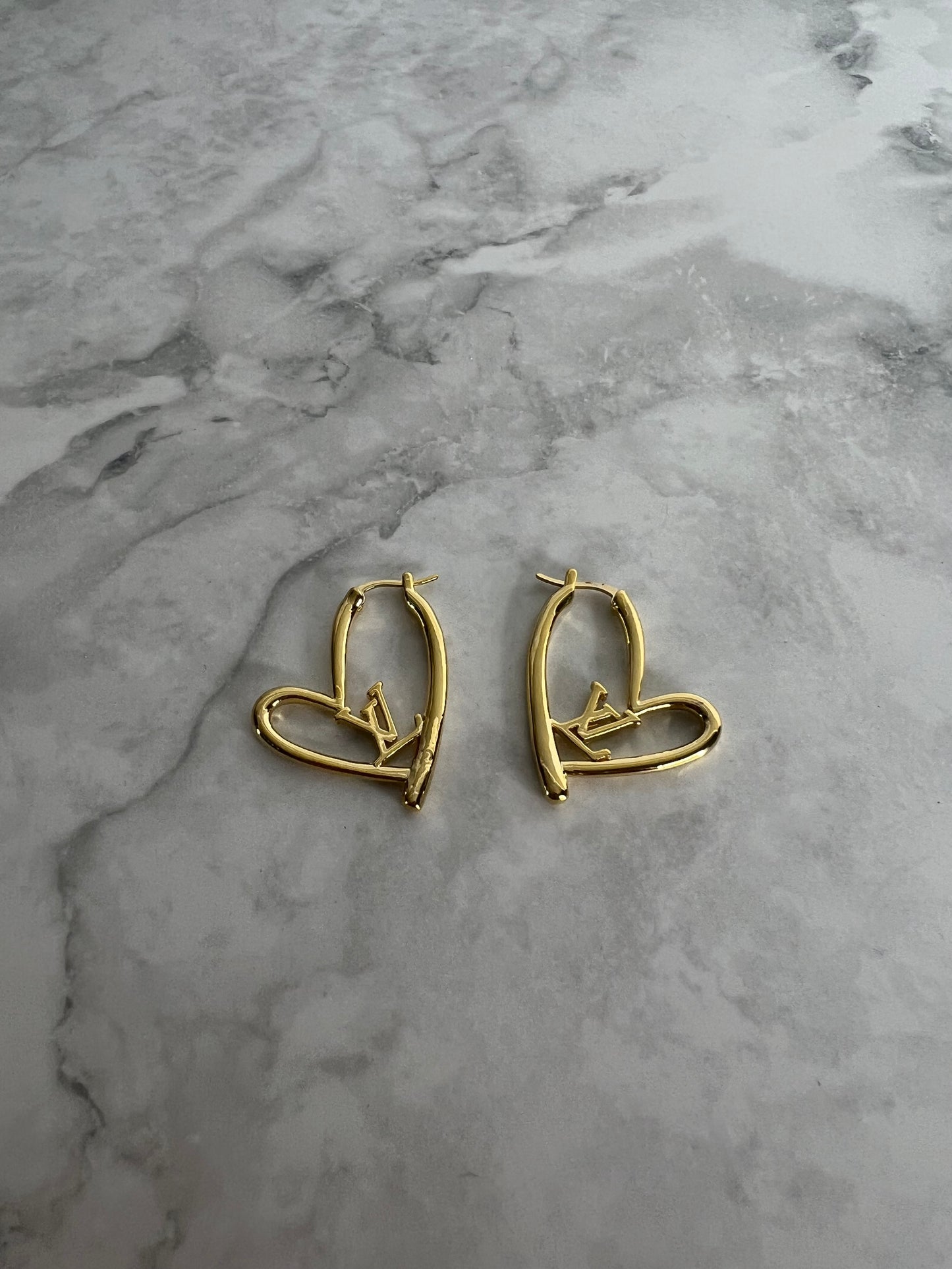 Heart shaped earrings lv