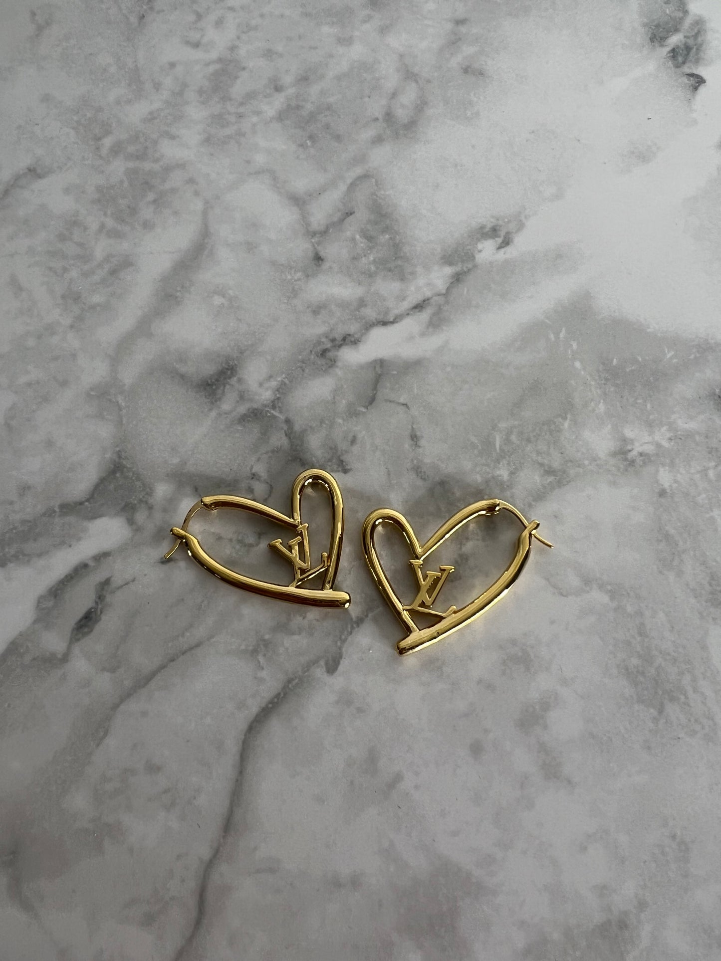 Heart shaped earrings lv