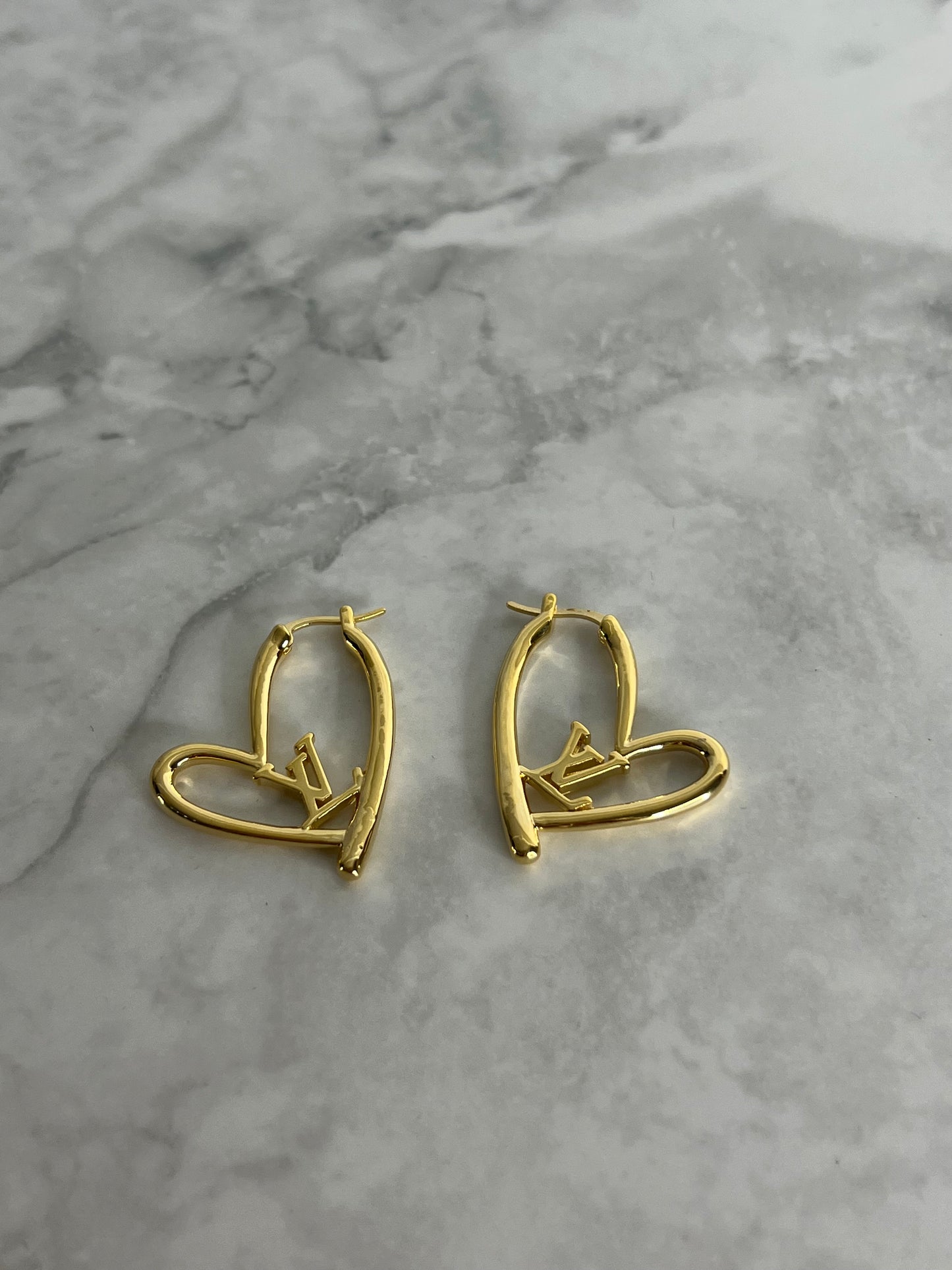 Heart shaped earrings lv