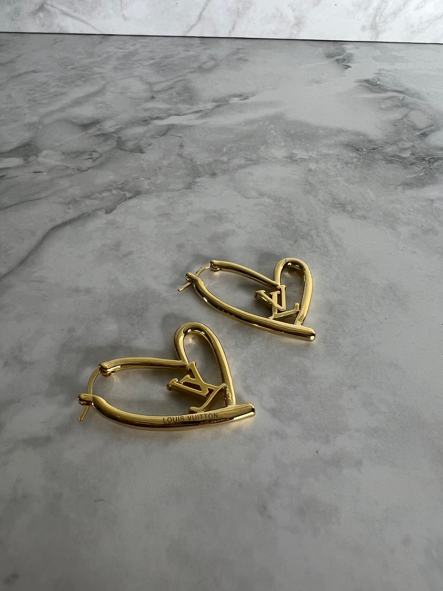 Heart shaped earrings lv